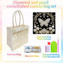 A canvas bag embellishment set shown on a white background with pastel rainbow corners. The set includes a clear vinyl canvas tote bag with cream handles, a black canvas panel featuring a jeweled butterfly and floral design labeled 'Diamond And Pearl Canvas,' a small 'Diamond Bag' packet, and 'Diamond Drilling Tool Accessories' including a green tray, white and pink rods, and a pink pencil.