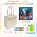 A canvas bag set with a clear front panel and beige handles, shown alongside a framed underwater canvas artwork, a diamond bag, and diamond drilling tool accessories on a pastel gradient background.