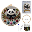 Embroidery DIY art kit shown with a completed panda embroidery hoop piece, a package insert, a hoop size marker, needles, thread, and thread cards on a white background.