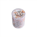 A cylindrical scented candle in a clear plastic container with a floral lid label reading 'BRILLIANT LIKE A FLOWER' and 'have a good day'.