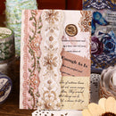 Decorative card with lace and floral patterns on a wooden surface