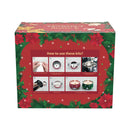 A boxed holiday candle kit with a red front panel showing step-by-step instructions and festive green and red holly and poinsettia borders.