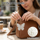 A woman at a cafe inserts a pearl butterfly keychain into a brown leather clutch bag. The image includes text overlays reading 'DIY Pearl Keychain' and a circular inset showing different pearl sizes.
