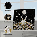 Decorative wall art with pearl embellishments and butterflies on a black background, displayed indoors.