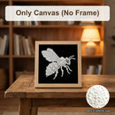 A framed canvas art piece featuring a sparkling silver beehive design on a black background, displayed on a wooden table in a warm, blurred library setting. Text overlays read 'Only Canvas (No Frame)' and 'Pearls of different sizes' with a circular inset showing the pearl texture.