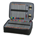An open zippered pencil case filled with colored pencils, shown on a plain white background. The case is dark gray and black, with elastic bands holding the pencils in place and two small gold-toned sharpeners on the inside flap.
