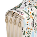 Close-up of a zippered fabric case or organizer with a cream base and a colorful floral and botanical print in green, orange, pink, and blue. The case has multiple silver metal zipper pulls and a matching fabric strap.