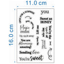 A sheet of clear stamp designs with black printed phrases such as 'You', 'Sweet as Honey', 'Magic Inside', 'You're blooming amazing!', and 'Sending love You're sweet', shown on a white background with blue dimension lines indicating 11.0 cm width and 16.