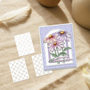 Floral card with decorative elements on a textured surface