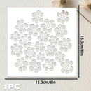 A white square stencil or template with a repeating floral cutout pattern, shown on a light textured background. Black measurement lines and text indicate dimensions of 15.
