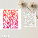 Two square laser-cut paper designs displayed on a light textured background with dried flowers. The left sheet shows a repeating floral damask pattern in a red-to-pink gradient, and the right sheet shows a white floral cutout pattern.