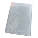 A rectangular translucent plastic sheet with embossed floral rose patterns along the borders, shown on a plain white background.