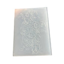 A rectangular translucent plastic or acrylic block featuring an embossed floral design of hibiscus or similar flowers with leaves, shown on a plain white background.