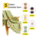 A crocheted blanket with a green and white diamond grid pattern and yellow sunflower motifs is draped over a wooden chair. The image includes text reading '5 Colors Crochet Yarn' and shows five skeins of yarn with labels, indicating available colors and roll quantities.