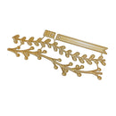 Gold metal decorative branch and leaf embellishment with a ribbon banner piece, shown on a plain white background.