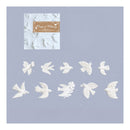 White bird-shaped nail art stickers or decals arranged on a light lavender background, with a small branded sample card in the upper left reading Wings & Whims.