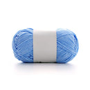 Light blue skein of yarn with a white label on a white background