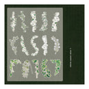 A sheet of decorative patterned papers featuring various floral and botanical designs in shades of green and white, arranged on a gray backing card with a dark green textured border. The text '4.