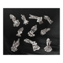A set of nine silver-toned metal enamel pins depicting various Victorian and Gothic hand and glove motifs, arranged on a draped black fabric background.