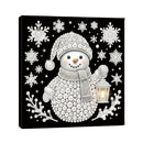 A square black canvas wall art print featuring a stylized snowman made of white pearls and beads, surrounded by white snowflakes and branches, with a glowing lantern in one hand.