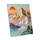 A square canvas wall art piece featuring a stylized mountain landscape made with layered metallic and pearl-like textures. The artwork shows gold and silver mountains, turquoise and pink water or clouds, a peach-to-orange sun, and a pale blue sky.