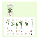 A sheet of white adhesive stickers featuring botanical illustrations, including white roses, a tulip, lily of the valley, and a small flower, each with a small printed quote beneath it. A smaller preview of the sticker sheet is shown in the upper left corner against a pale green background.