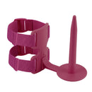 A magenta pink adult novelty product featuring a suction cup base with a long, tapered plug, connected to a plastic frame with two adjustable hook-and-loop straps, shown on a solid white background.