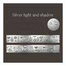 Silver floral embossed nail art foil sheets on a dark brown textured background, with the text 'Silver light and shadow' and a circular logo badge.