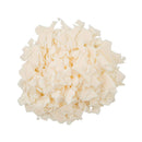 A pile of off-white, irregularly shaped flakes or chips, likely wax flakes or cosmetic powder, isolated on a solid white background.