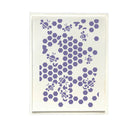 A square art print or card featuring a lavender purple pattern of bees and hexagons on a warm off-white background, presented in a clear protective sleeve against a white backdrop.