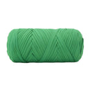 A single roll of bright green elastic cord or ribbon, photographed against a solid white background.