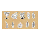 A sheet of botanical decals featuring ten different illustrated fern and leaf designs in black and white, presented on a tan rectangular backing against a white background.
