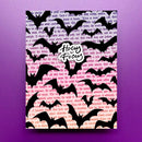 A square art print or card featuring a black bat silhouette pattern over a background of pink and purple book text, with a white circular logo reading 'Hocus Pocus' in the center, shown against a solid purple background.