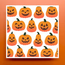 A square card or print featuring a repeating pattern of orange jack-o'-lantern pumpkins with dark brown faces and green stems on a white background, set against a solid orange backdrop.