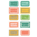 A set of 12 rectangular paper labels with scalloped edges, arranged in a grid on a white background. Each label features a different pastel color combination (teal, coral, yellow, green, peach) with a textured burlap-style center and a script word printed on it, such as 'beautiful', 'today', 'documented', 'memories', 'thankful', 'loves this', 'snapshots', 'happiness', and two blank labels.