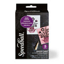 Speedball Speedy-Carve block printing kit in retail packaging, featuring a black box with purple and white graphics showing the included carving tool and sample printed blocks.