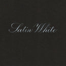 The words 'Latin White' written in elegant white cursive script centered on a dark charcoal textured background.