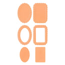 Six peach-colored paper craft dies in oval and rectangular scalloped and solid shapes, arranged on a plain white background.