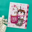 A handmade holiday greeting card featuring cartoon penguins and a snowman with hot cocoa cups, styled on a teal background with marshmallows and a ceramic mug.