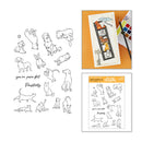 Clear stamp set featuring black line art illustrations of various dog and cat poses, shown alongside product packaging and a sample stamped design on an orange background.