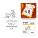 Spellbinders 'Candy Corn Kisses' cling rubber stamp set by House of Magic Designs, featuring a black and white line art illustration of a mouse and a pumpkin on a white background, alongside a sample stamped card and the retail packaging.