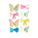 Colorful butterfly and bow hair accessories on a white background