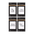 Four packages of RetroRoses Press + Foil Spellbinders arranged in a 2x2 grid on a white background. The packages feature black and gold designs with white sample text cards showing holiday greetings: 'Joy to the World', 'Merry Christmas', 'Season's Greetings', and 'Happy Holidays'.