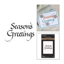 A card craft product display featuring a finished greeting card that reads 'Season's Greetings' with decorative snowflakes, alongside the retail packaging and a large decorative 'Season's Greetings' text on a white background.
