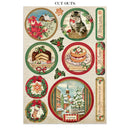 A sheet of Christmas-themed cut-out stickers on a light beige background. The stickers feature festive illustrations including red poinsettias, a gingerbread house, a slice of chocolate cake, a decorated Christmas tree, holly leaves, and holiday text such as 'With Love,' 'Merry Christmas to you,' and 'CUT OUTS' at the top.