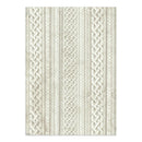 Textured patterned rug with braided design on a white background