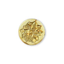 Gold decorative button with floral design on a white background
