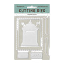A package of Stamperia Christmas Message cutting dies, featuring a white metal die set with a mailbox design and coordinating scoring and embossing dies, presented on a light beige backing card with a teal header.