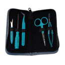 A 6-piece nail grooming kit with turquoise handles and silver metal tools, neatly arranged inside an open black zippered case with a gray fabric exterior.