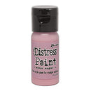 Bottle of Distress Paint with pink color on a white background